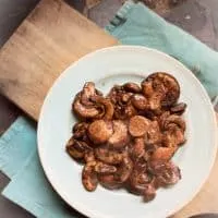 plate of mushrooms on cutting board