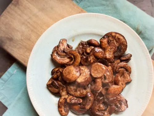 plate of mushrooms on cutting board