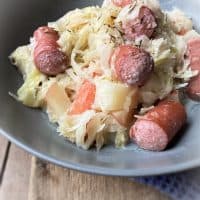 bowl of sauerkraut and hot dogs