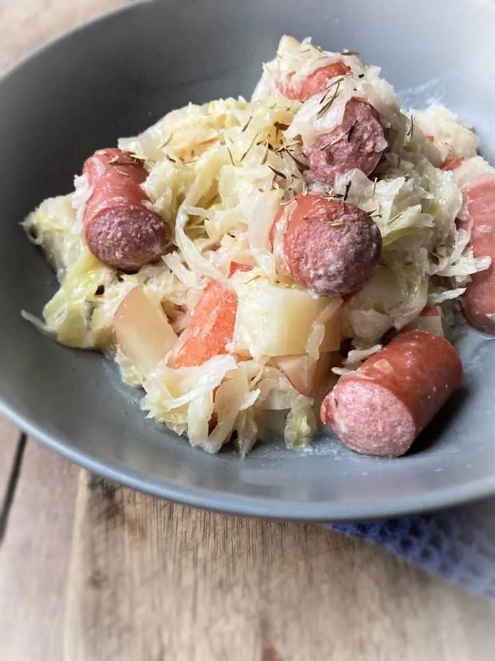 bowl of sauerkraut and hot dogs