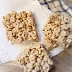 three peanut butter cheerio bars on table