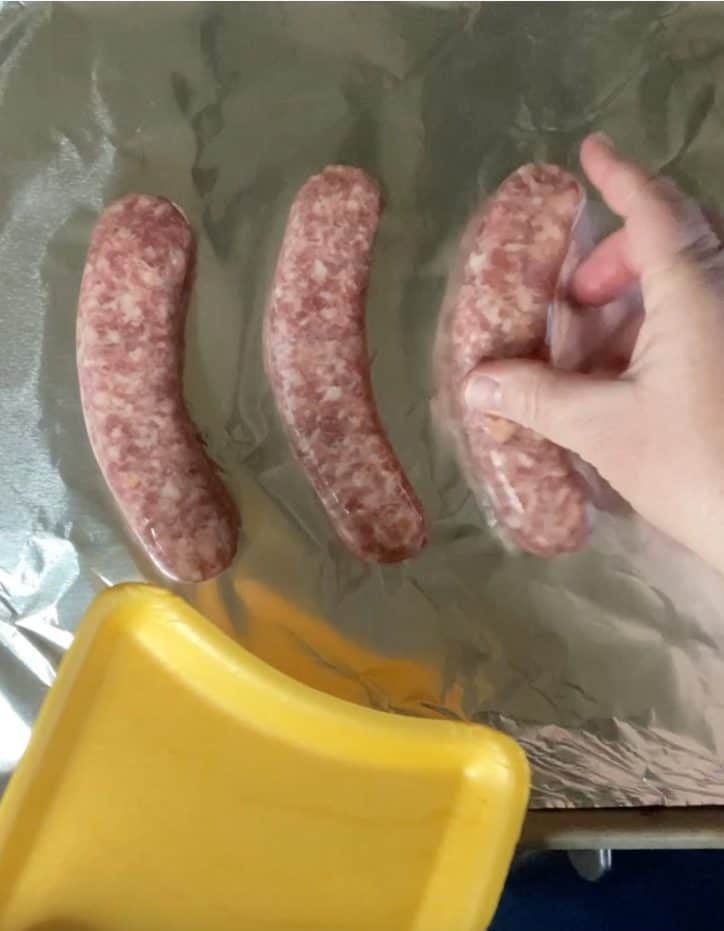 hand with sausage