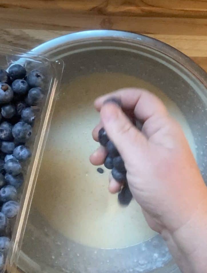 adding blueberries to mix