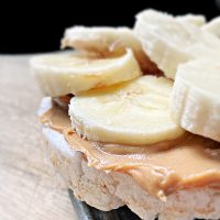 close up rice cake with peanut butter and banana