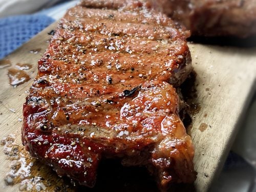 smoked ribeye steak on cutting board