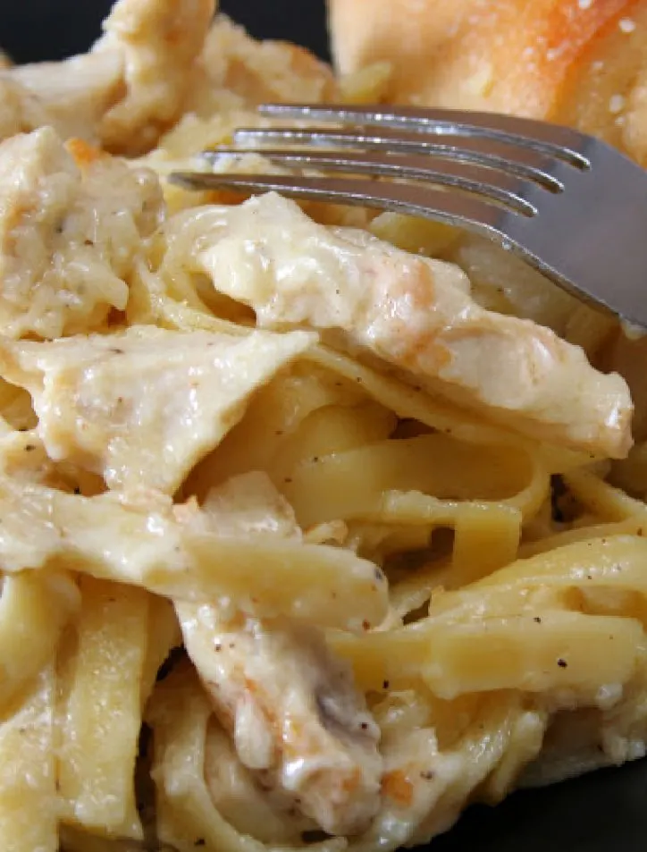 chicken alfredo and a fork