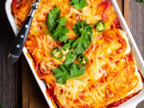 chili relleno casserole with enchilada sauce on table