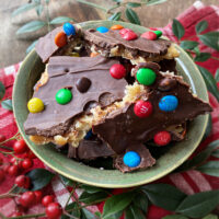 chocolate saltine toffee with m & ms in a bowl