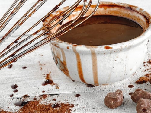 bowl of thick hot fudge sauce and whisk