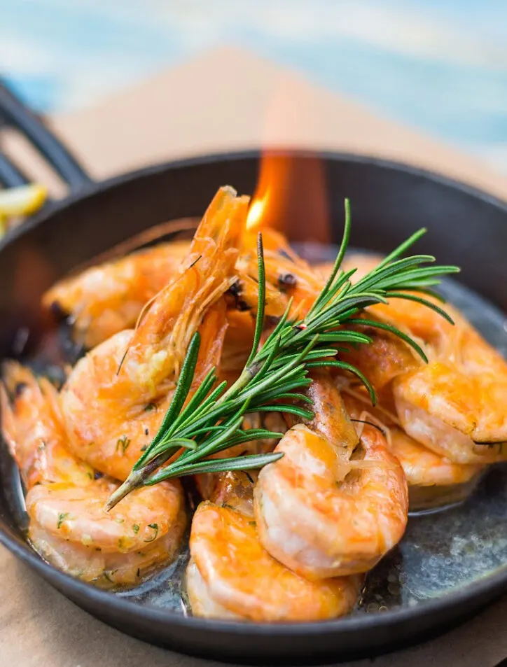 shrimp in a pan with flame