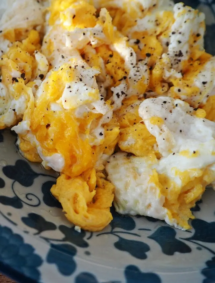 close up of scrambled eggs with pepper