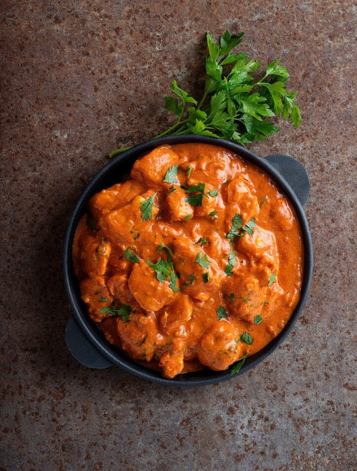 butter chicken sauce jar in black pan