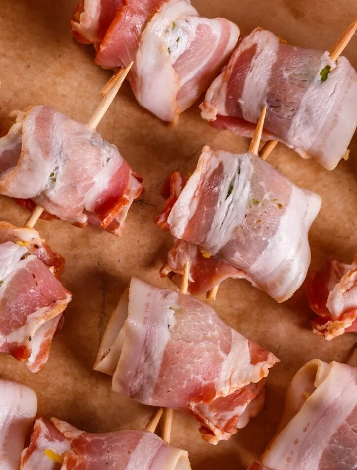 bacon wrapped chicken bites on paper
