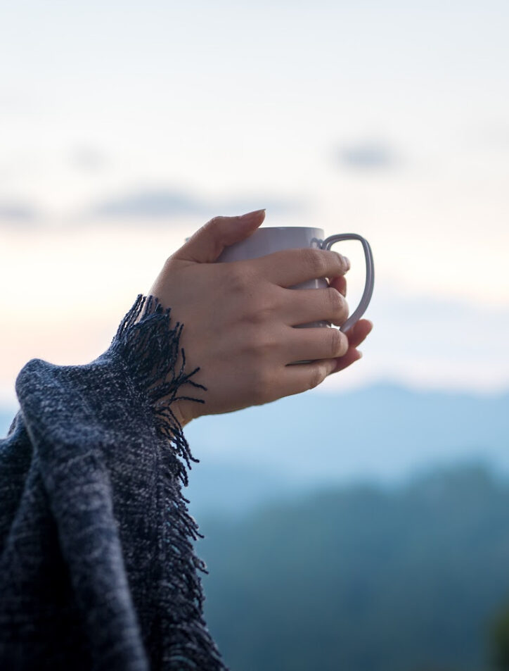 hands making coffee while traveling