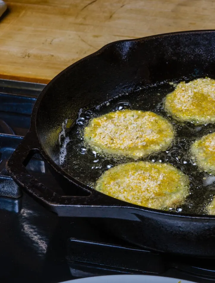 Easy Fried Green Tomatoes in a cast iron skillet