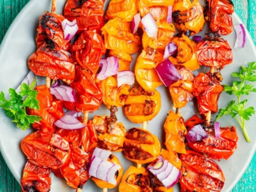 how to cut tomatoes for kabobs on blue background