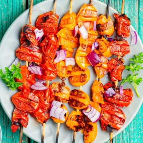 how to cut tomatoes for kabobs on blue background