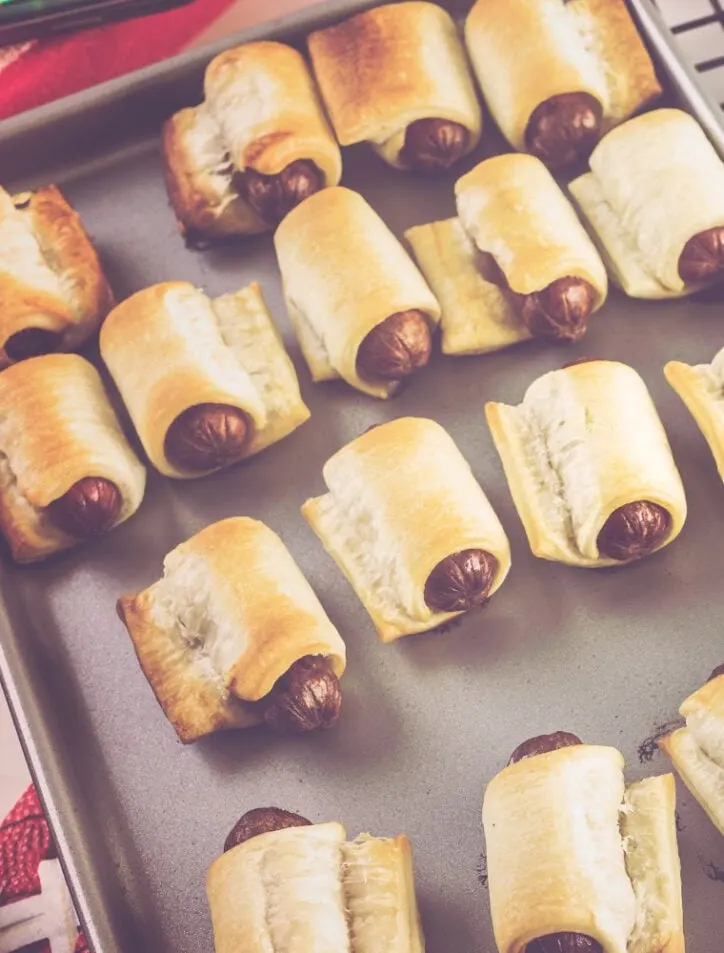 pigs in a blanket with little smokies on silver tray