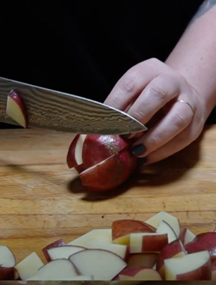 cutting red potatoes