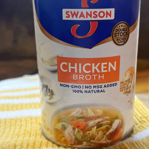 chicken broth in a can on a yellow towel
