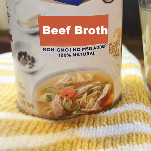 can of canned beef broth on towel