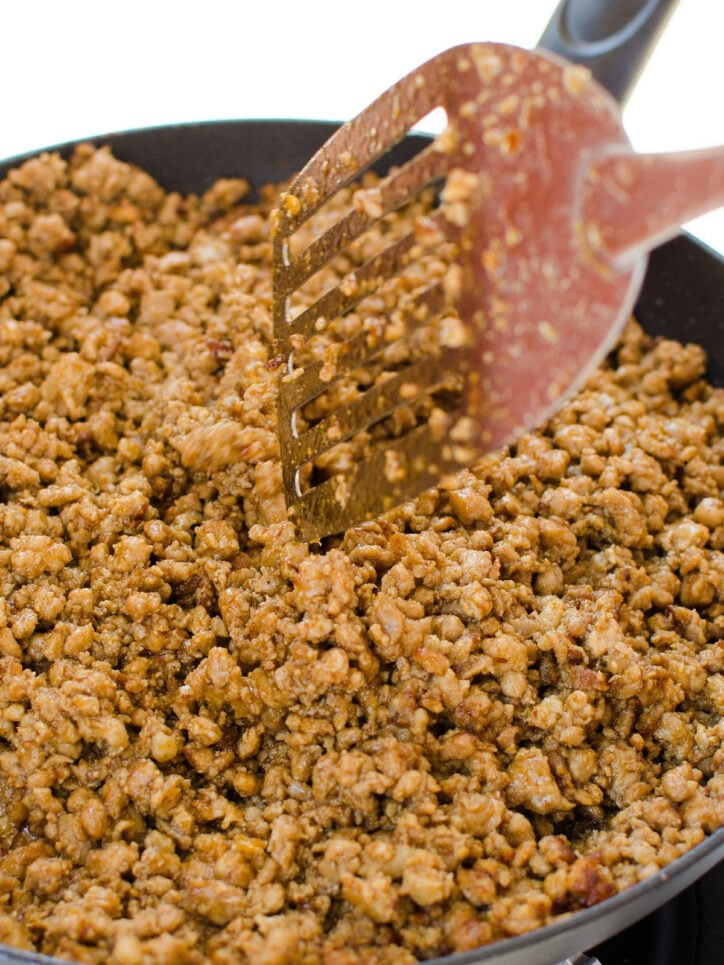 Use Your Potato Masher To Break Up Ground Meat in the Skillet