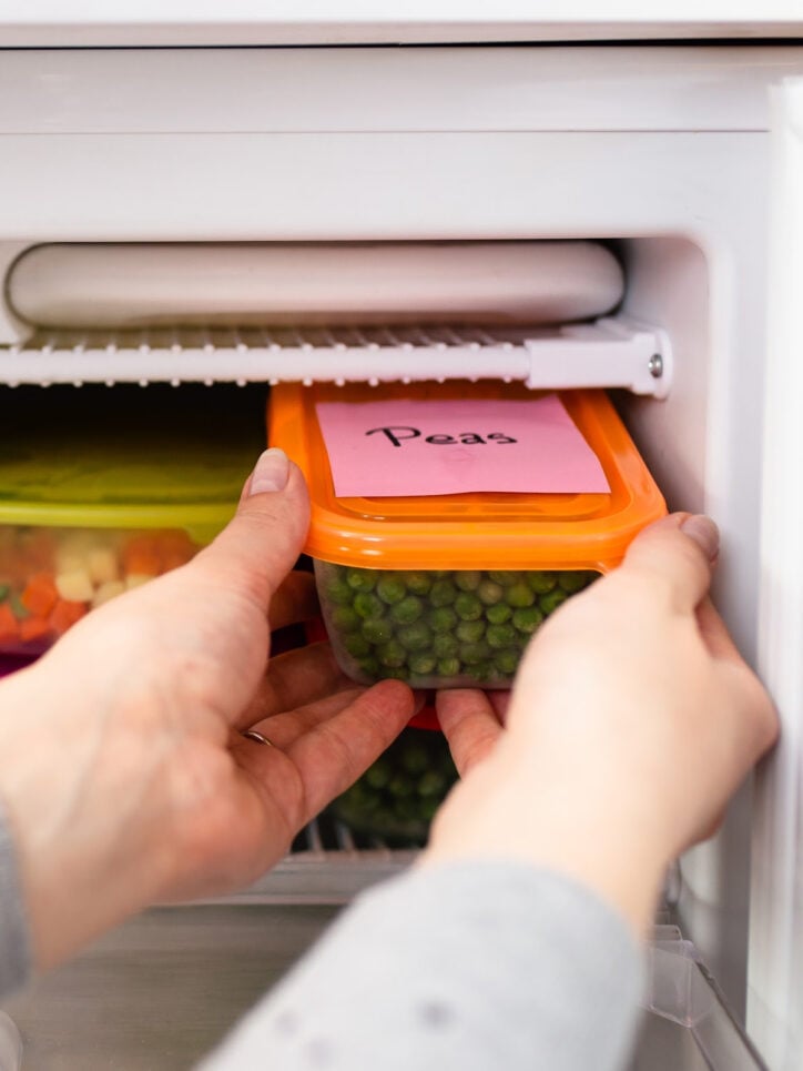 placing container in freezer.