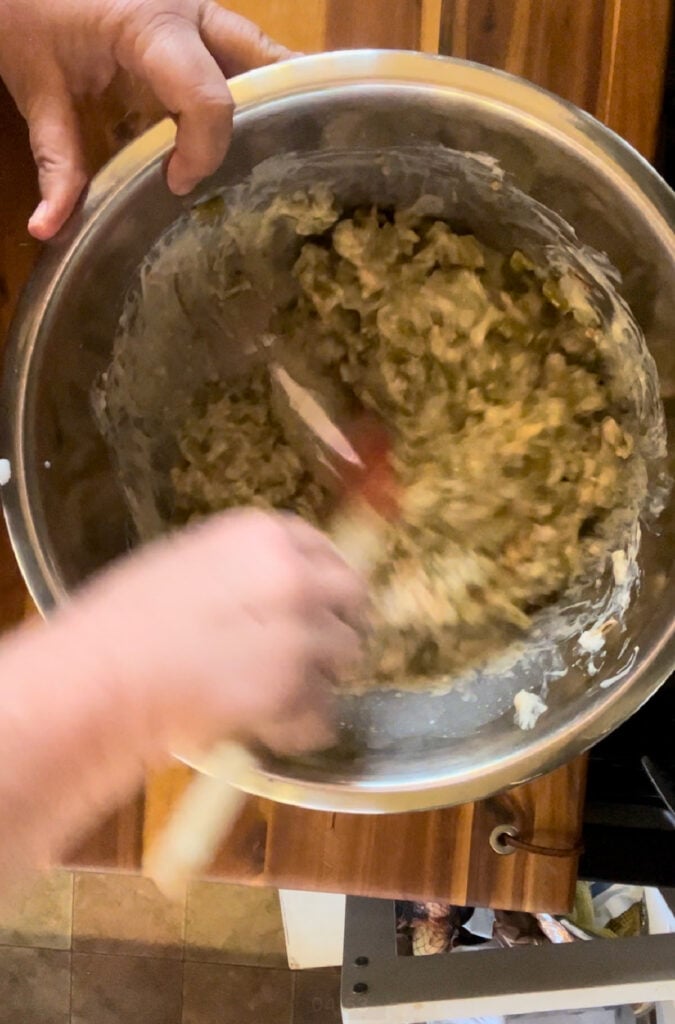 Mixing the ingredients for green bean casserole.