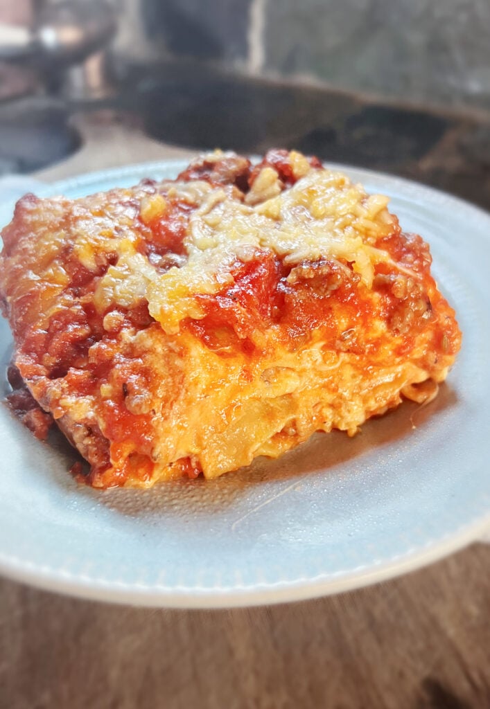 classico lasagna on blue plate.