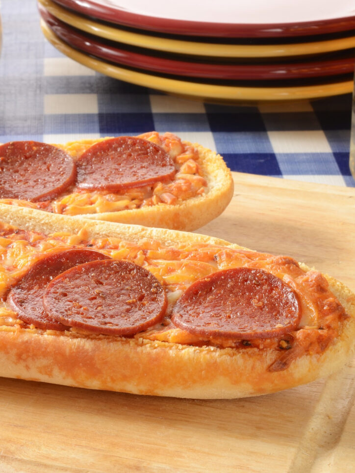 French bread pizza with large pepperonis.