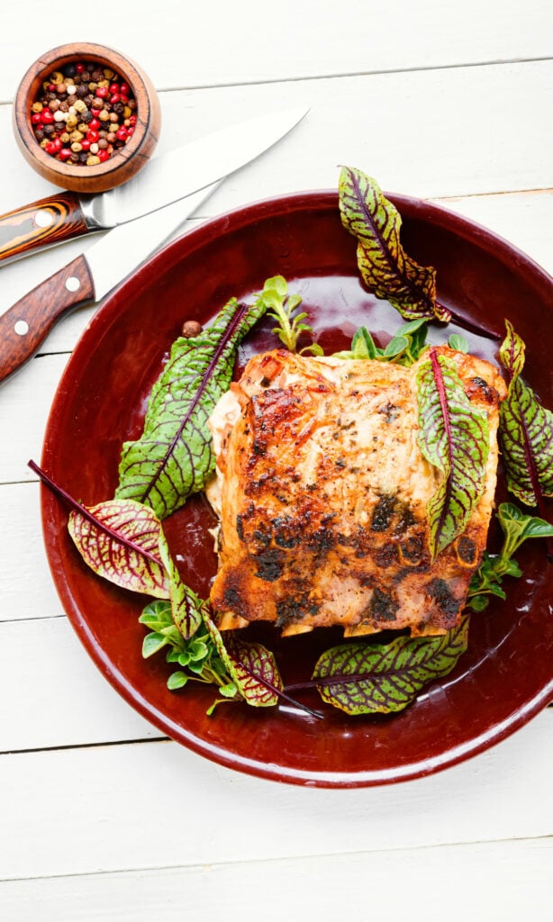 pan of easy bacon wrapped pork loin recipe (in oven).