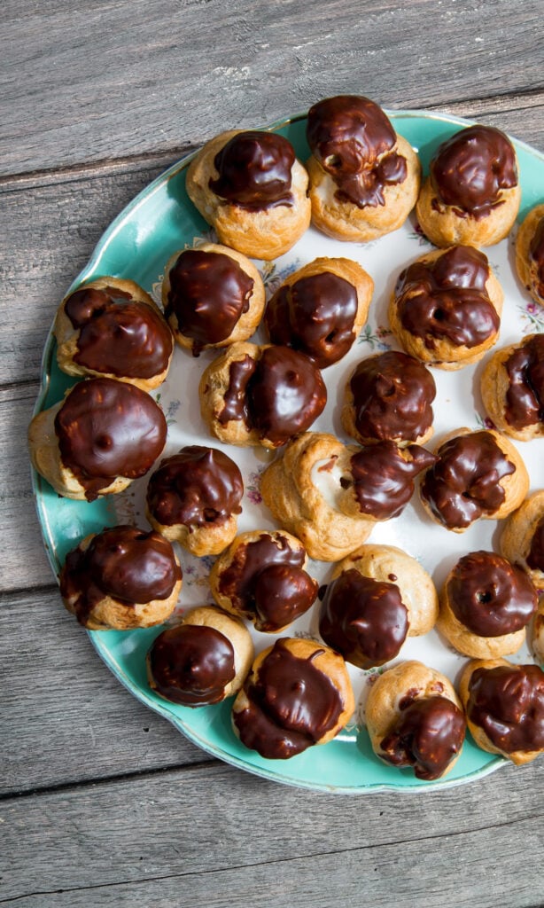 Plate of espresso custard filled cream puffs.