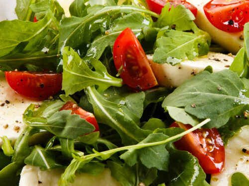 close up of arugula caprese salad