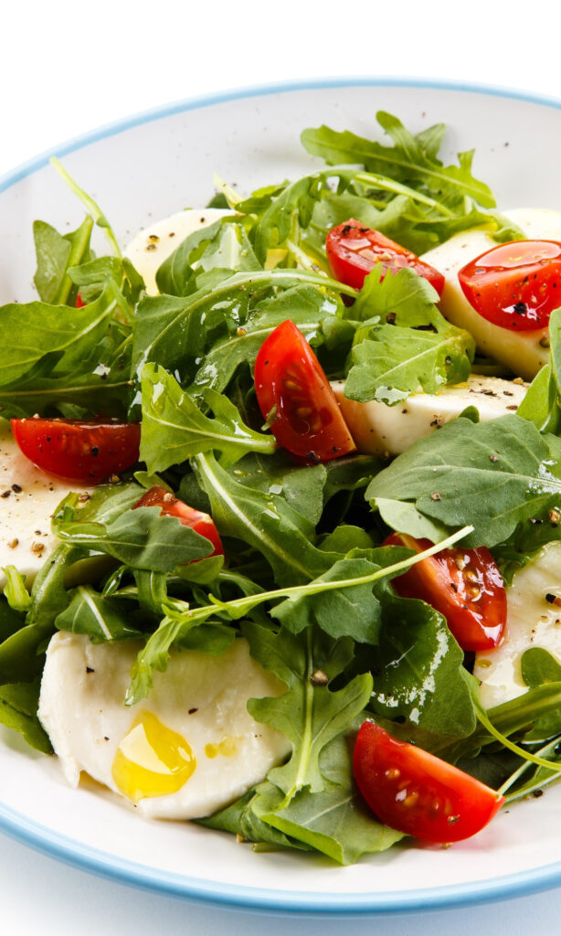Arugula Caprese Salad on plate. 