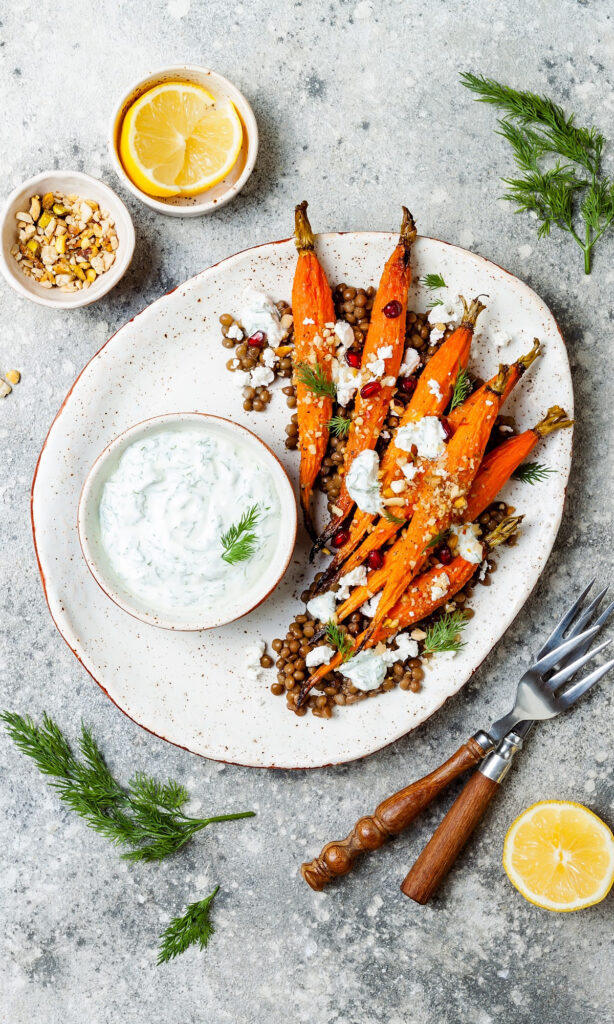 Vindaloo Curry Spiced Carrots on white plate. 