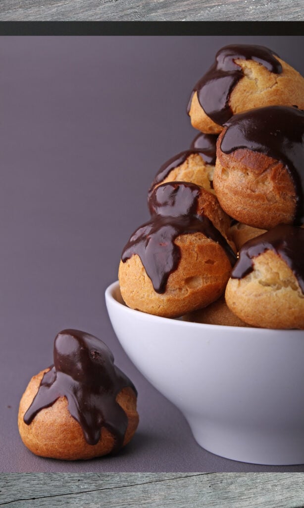 espresso custard filled cream puffs in a stack.