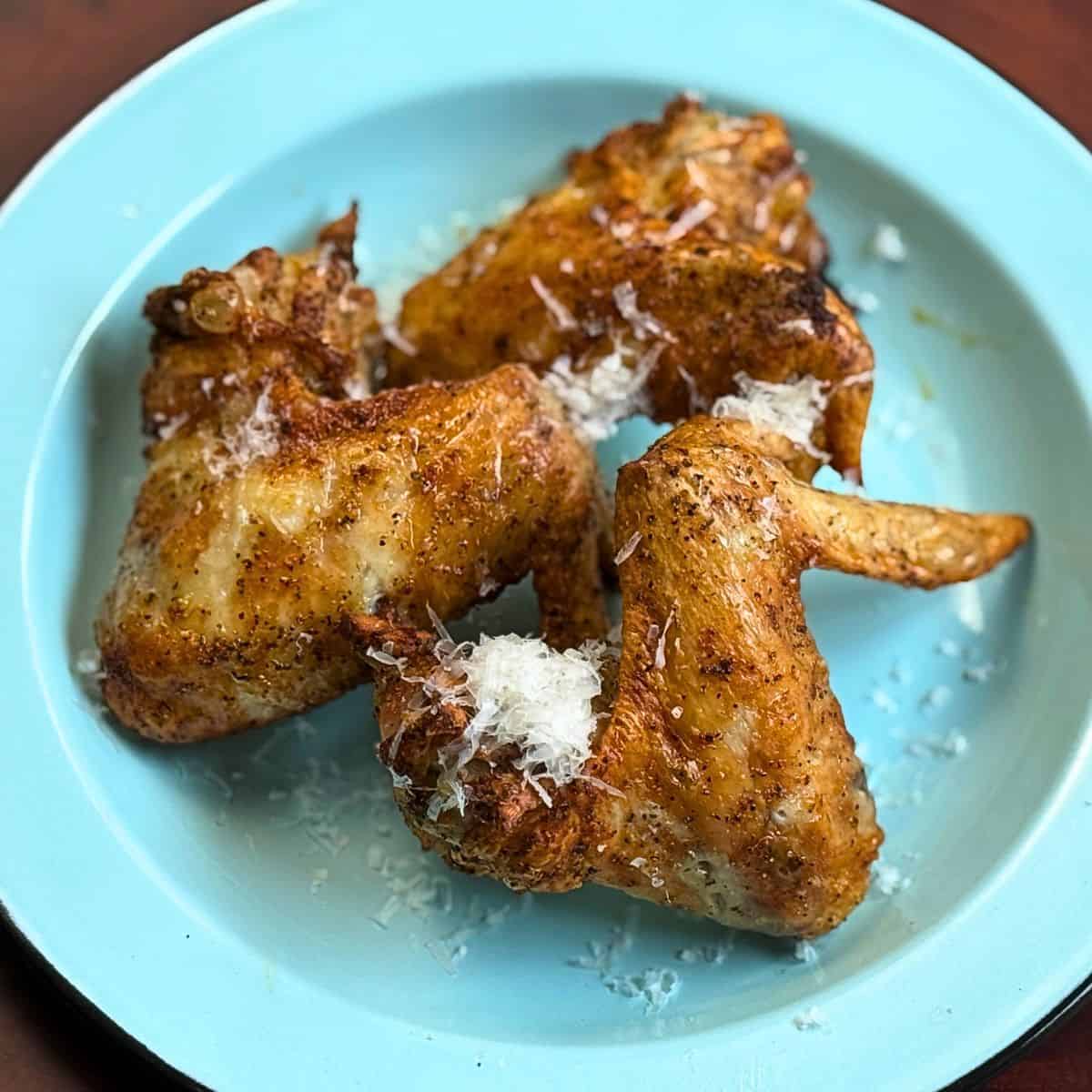 Chicken wings on a blue plate
