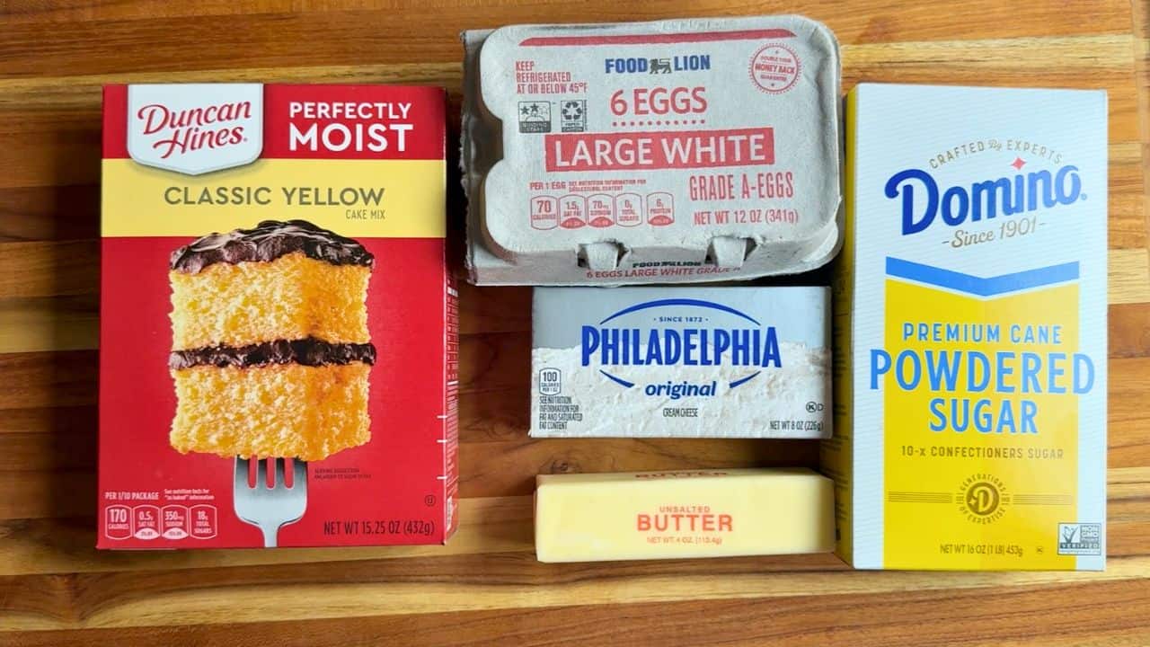 ingredients for gooey butter cake on a cutting board.